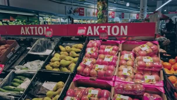 Bonn, Germany - 14 of Dec., 2019: interior shot of REWE supermarket in Bonn POV view. Shelves with fruit on sale — Stock Video