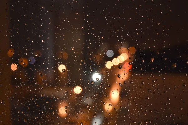 Rain drops on night window