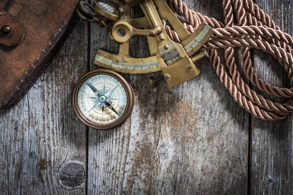 Compass,sextant and spyglass on the timber — Stock Photo, Image