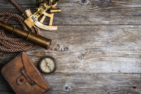 compass,sextant and spyglass on the timber