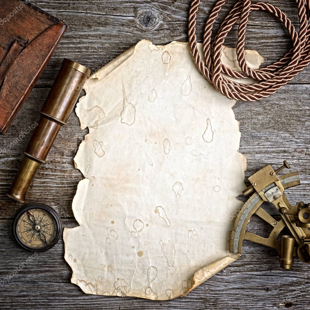 compass,sextant and spyglass on the timber