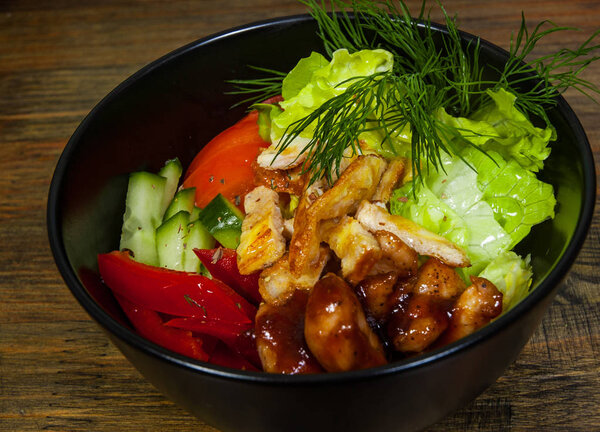 Teriyaki Chicken salad on a wooden background