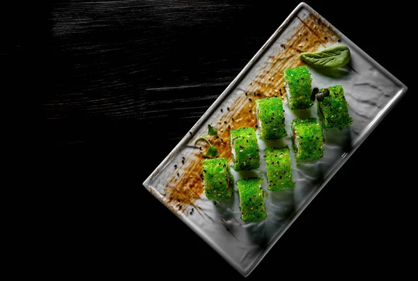 Sushi Rolls Tobiko Green Caviar Cream Cheese Fish Black Wooden — Stock Photo, Image