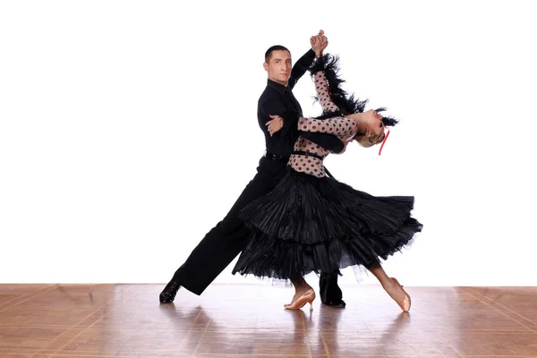 Latino dancers in ballroom against white background — Stock Photo, Image