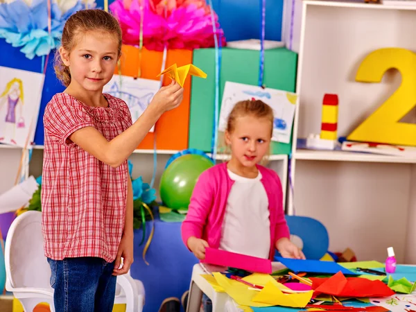 Group kids holding origami airplane in kindergarten . — Stock Photo, Image