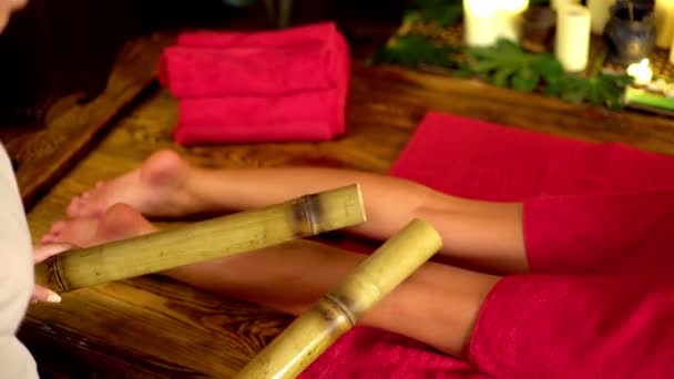 Young woman have tapping bamboo sticks therapy massage. — Stok video