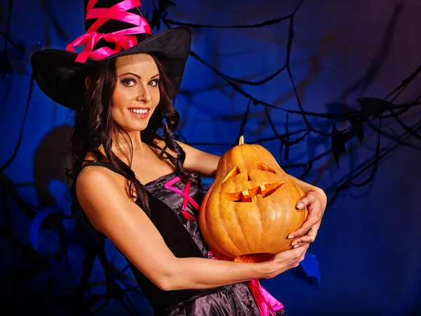 Season of Pumpkin is here. Witch learns make Jack OLanten. — Stock Photo, Image