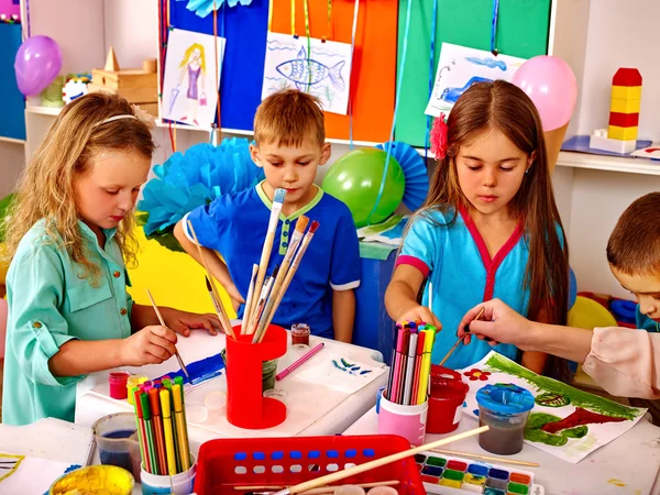 Happy childhood of group children painting in kindergarten . — Stock Photo, Image