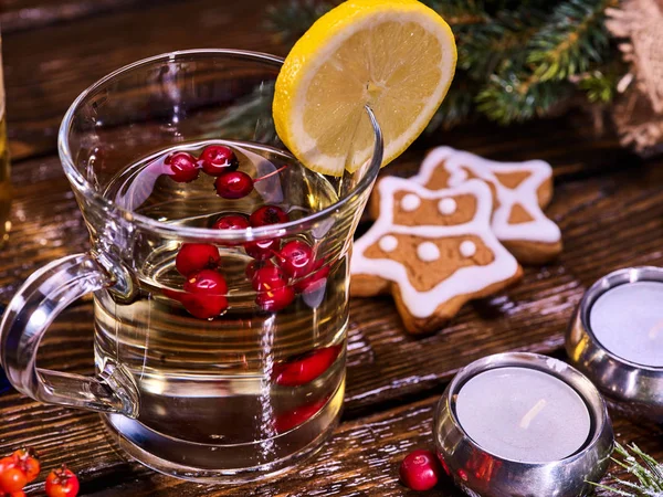 Glass mug and Christmas multicolored cookies on form stars. — Stock Photo, Image