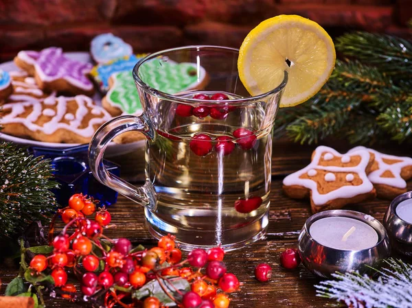 Glass mug and Christmas multicolored cookies on form stars. — Stock Photo, Image