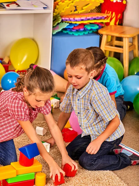 Children playing in kids club indoor. Lesson in primary school. — Stock Photo, Image