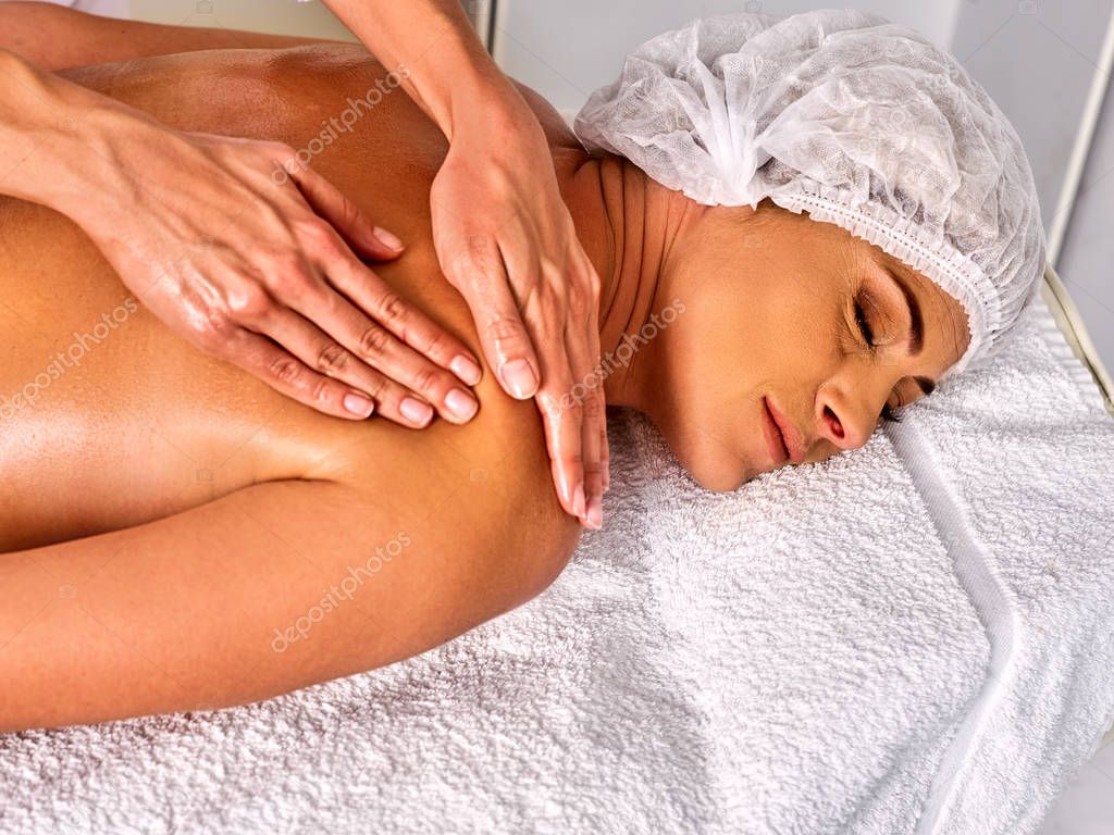 Massage therapy deals. Woman therapist making manual therapy back.