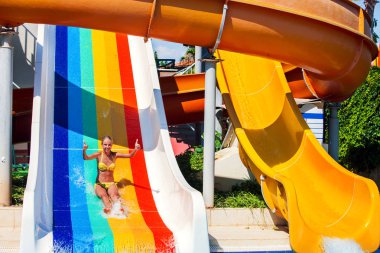 Swimming pool slides for children on water slide at aquapark.