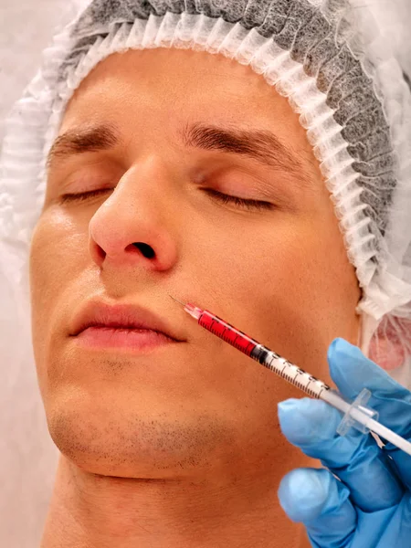 Dermal fillers of man in spa salon with beautician. — Stock Photo, Image