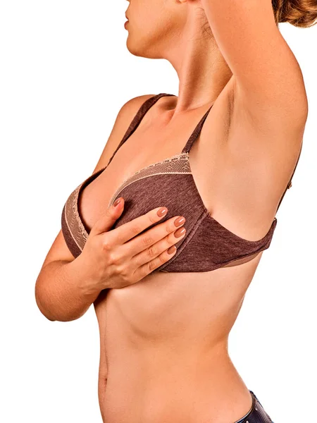 Auto esame del seno delle donne. Donna che indossa reggiseno . — Foto Stock