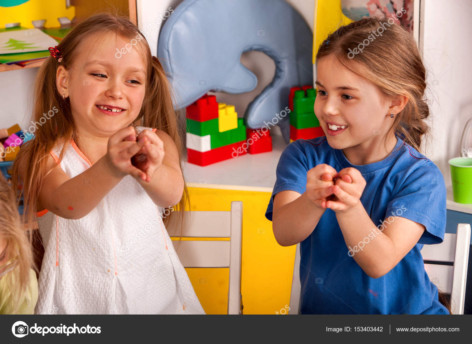 Finger Game On Break School In Painting Class Small Student In Art Class Physical Education Of Little Girls Playing Craft Drawing Develops Creative Finger Game On Break School In Painting Class Small Student In Art Class Physical Education Of Little Girls Playing Craft Drawing Develops Creative