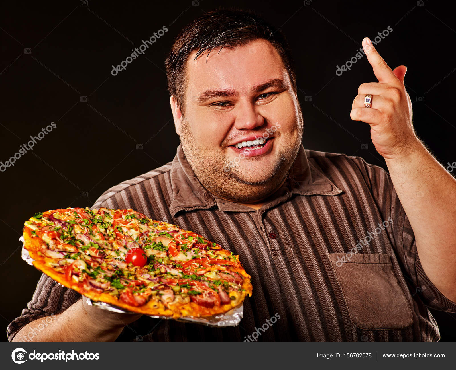 Fat man eating fast food pizza . Breakfast for overweight person. Stock  Photo by ©poznyakov 156702078