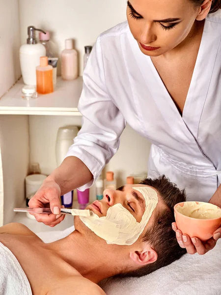 Mud facial mask of woman in spa salon. Face massage . — Stock Image Mud facial mask of woman in spa salon. Face massage . Stock Photo