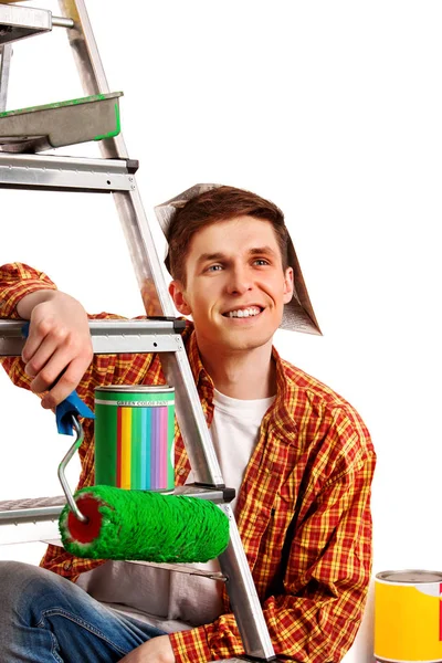 Repair home man holding paint roller for wallpaper. — Stock Photo, Image