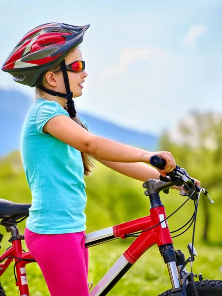 Child traveling bicycle in summer park. — Stock Photo, Image