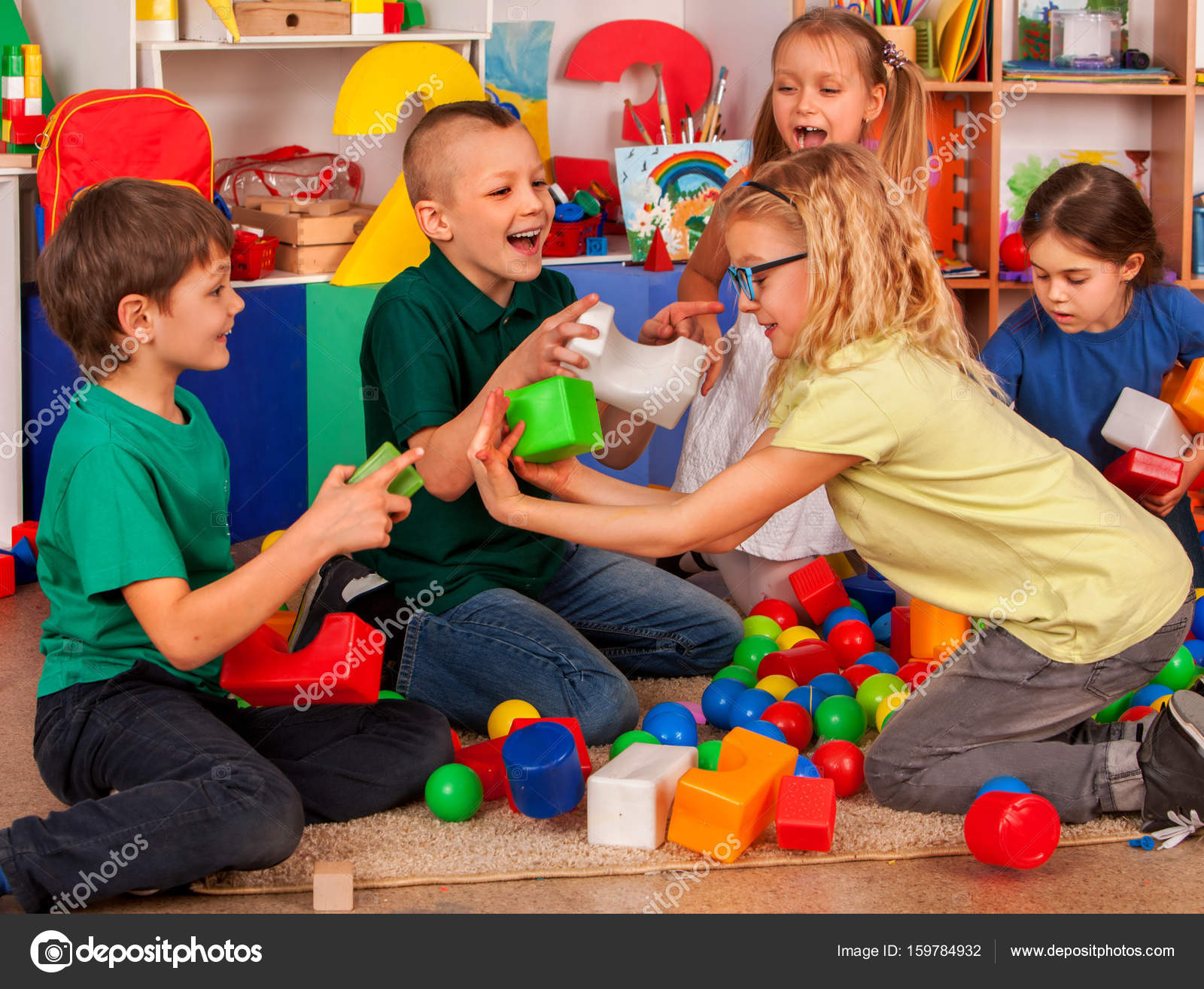 Children building blocks in Group kids playing toy