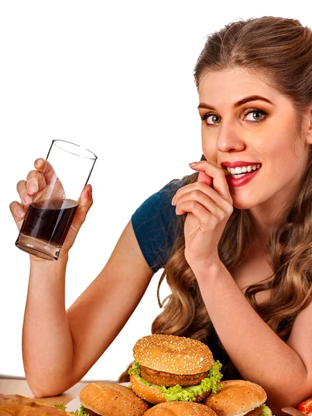 Woman eating french fries and hamburger. — Stock Photo, Image