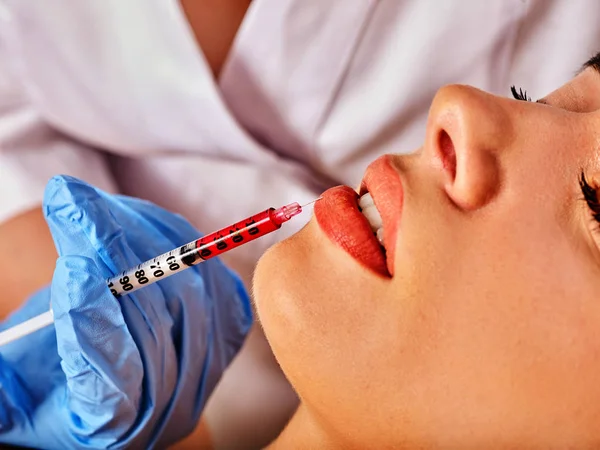 Dermal fillers lips of woman in spa salon with beautician. — Stock Photo, Image