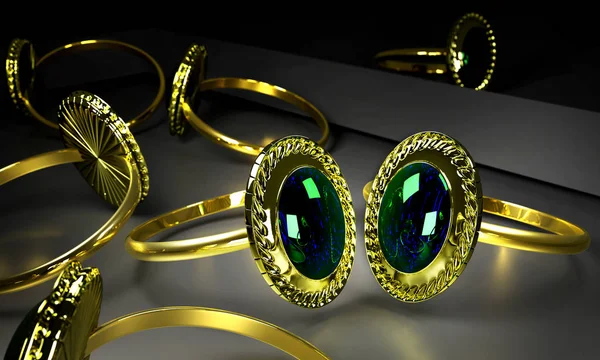 Dva zlaté prsteny s drahokam v obchodě. — Stock fotografie