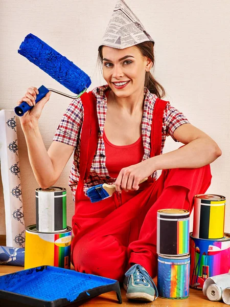 Repair home woman holding paint roller for wallpaper. — Stock Photo, Image