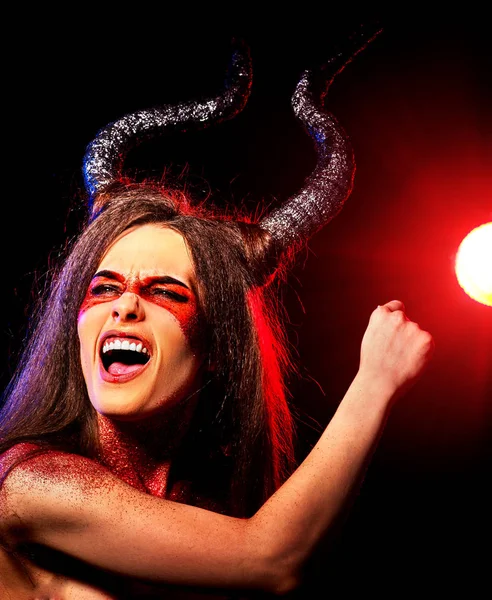 Black magic ritual mad satan woman in hell on Halloween.