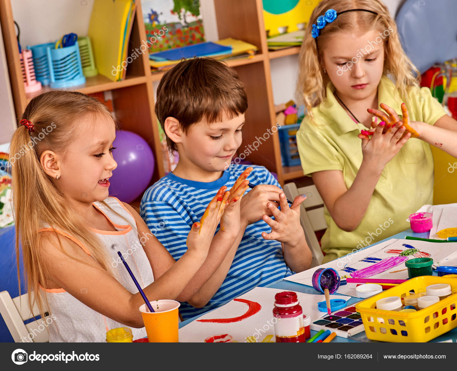 Small Students Girl Finger Painting In Art School Class Stock Photo Small Students Girl Finger Painting In Art School Class Stock Photo