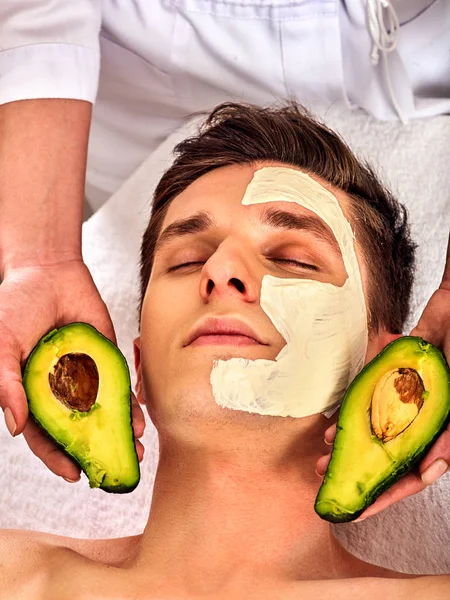 Facial mask from fresh fruits for man. Beautician apply slices. — Stock Photo, Image