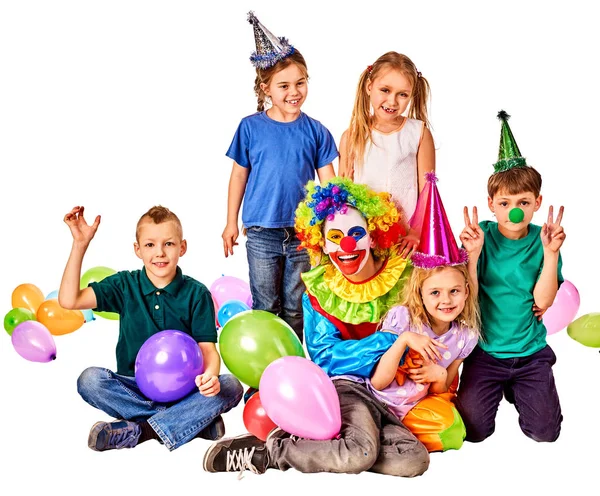 Birthday child clown playing with children. Kid holiday cakes celebratory. Stock Photo