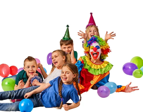 Birthday child clown playing with children. Kid cakes celebratory. Stock Picture