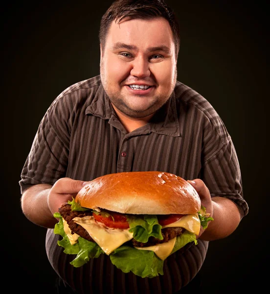 Fat man eating fast food hamberger. Breakfast for overweight person. — Stock Photo, Image