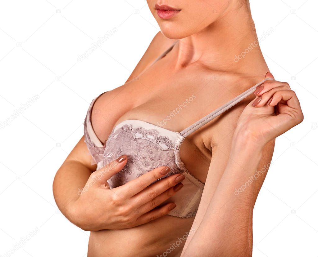 Breast self exam of women. Woman wearing bra.