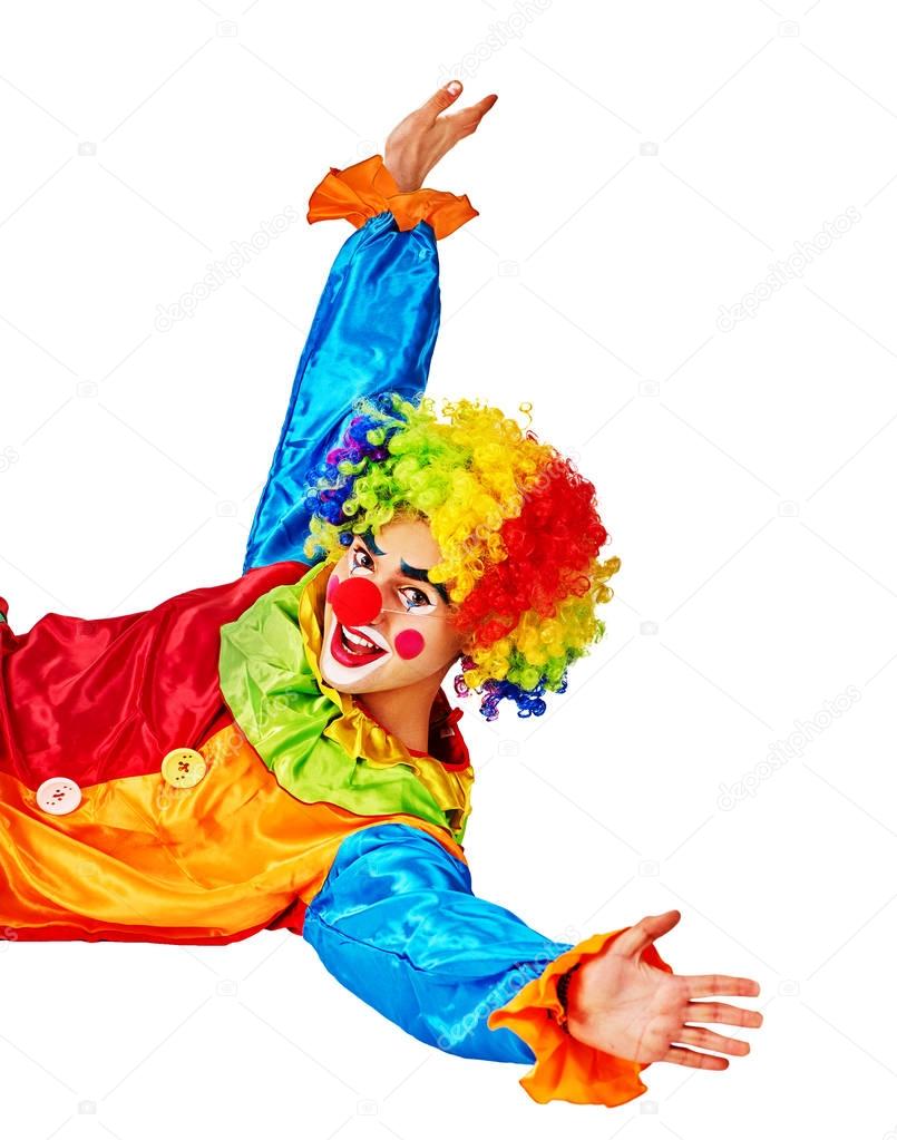 Birthday child clown with cake lying on floor thumb up