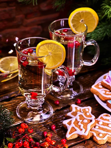 Christmas cookies on plate and two glasses mug with lemon. — Stock Photo, Image