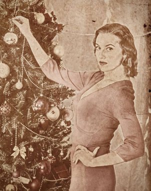 Nostalgy Christmas woman dressing Xmas tree. clipart