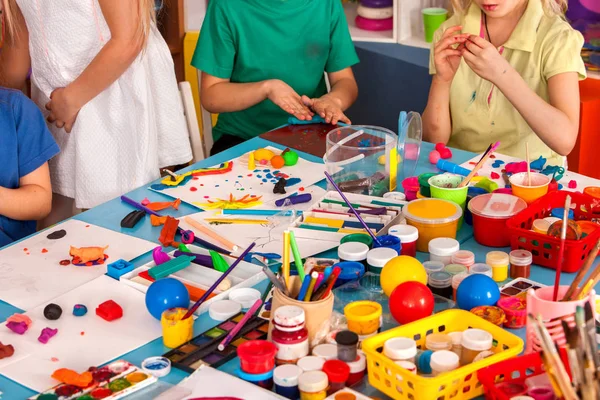 Child dough play in school. Plasticine for children.