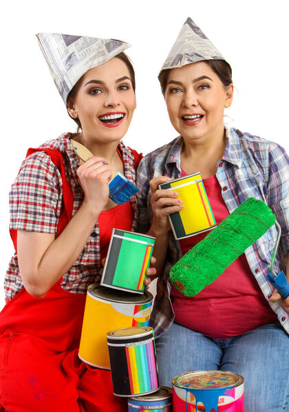 Repair home women holding Bank with paint for wallpaper.
