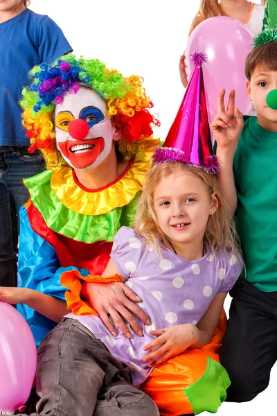 Birthday child clown playing with children. Kid holiday cakes celebratory. Stock Picture