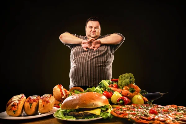 Diet fat man makes choice between healthy and unhealthy food.