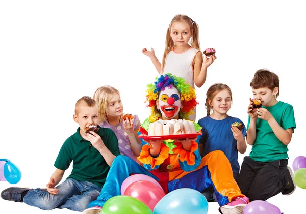 Birthday child clown playing with children. Kid cakes celebratory. Stock Photo