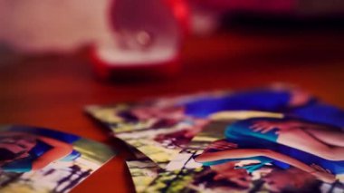 Hand holding and sorted photo with love story pictures.