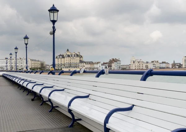 Deserted seats on pier in Eastbourne UK — Stock Photo, Image