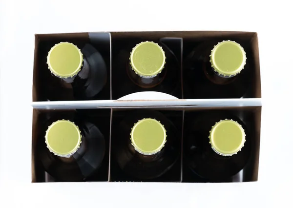 Six bouteilles de bière avec capuchons face à la caméra — Photo