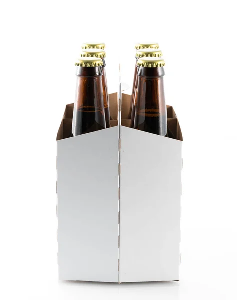 Six bottles of beer in cardboard carrier — Stock Photo, Image