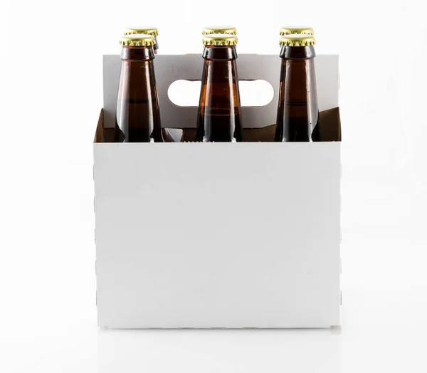 Six bottles of beer in cardboard carrier — Stock Photo, Image