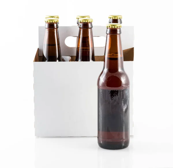 Five bottles of beer in cardboard carrier — Stock Photo, Image